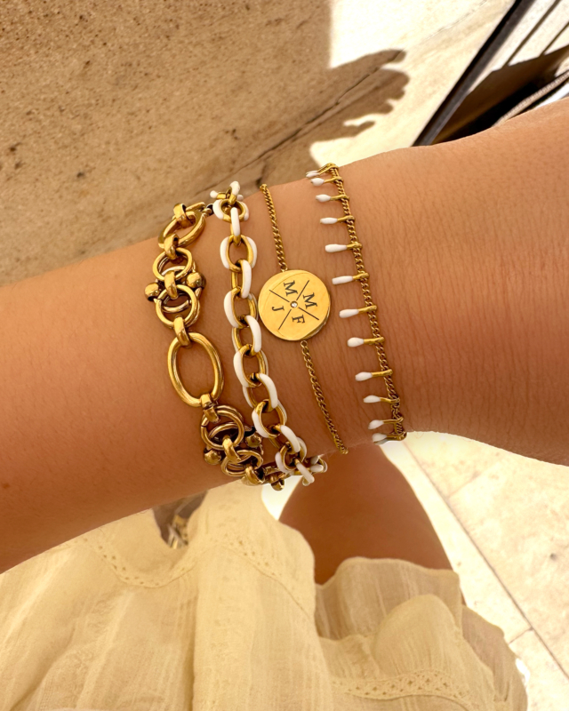 Gouden armparty met witte details