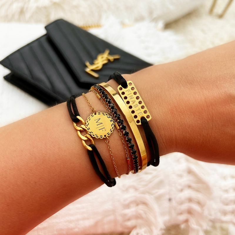 Gouden armparty met zwarte details