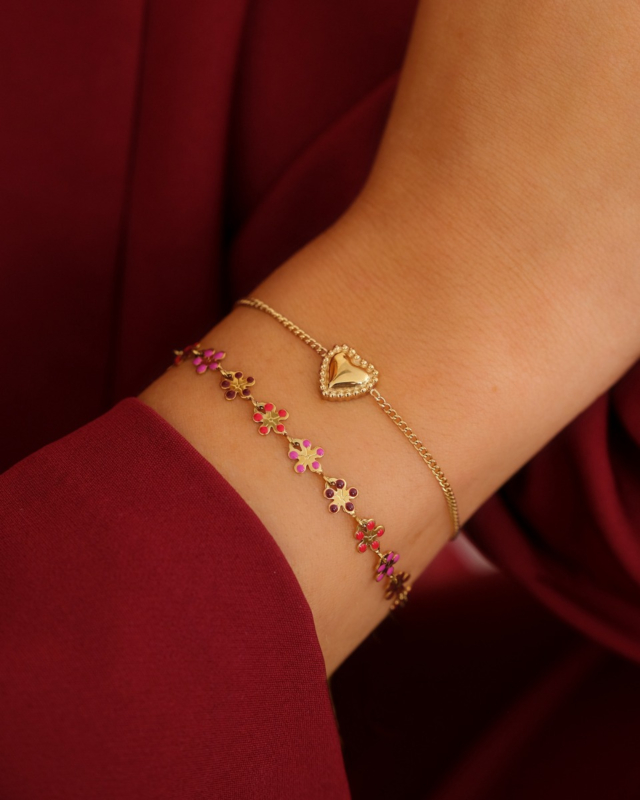 Gouden armparty met bloemetjes en hartjes