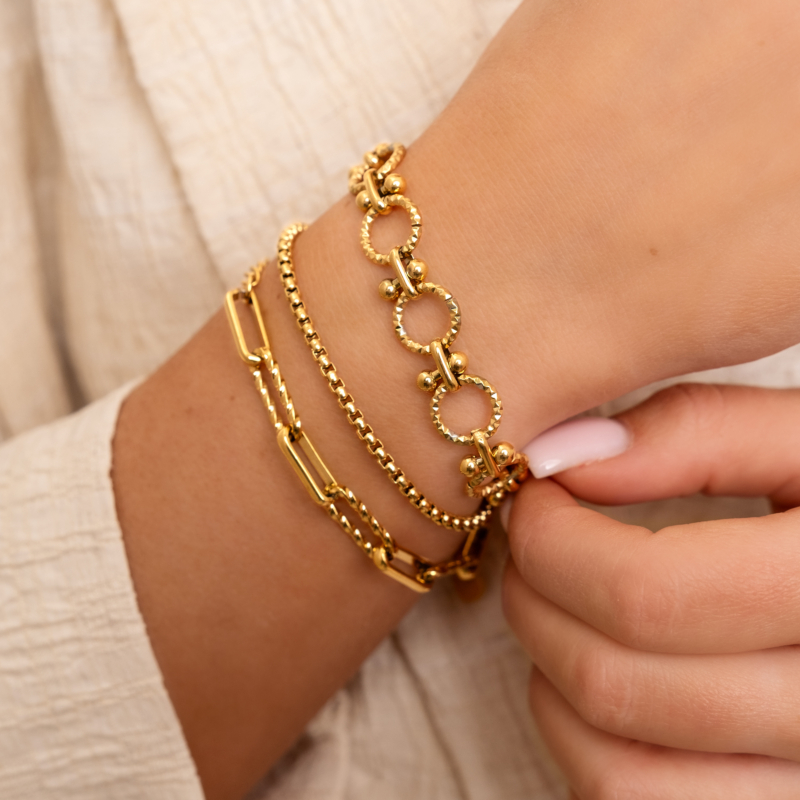 Gouden armparty met chains