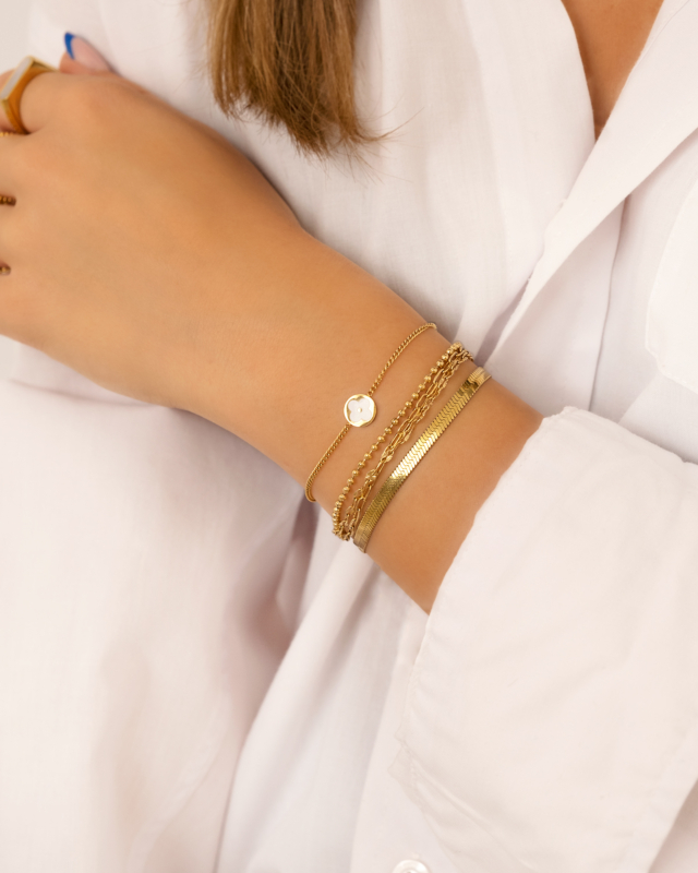 Gouden armparty met clovers