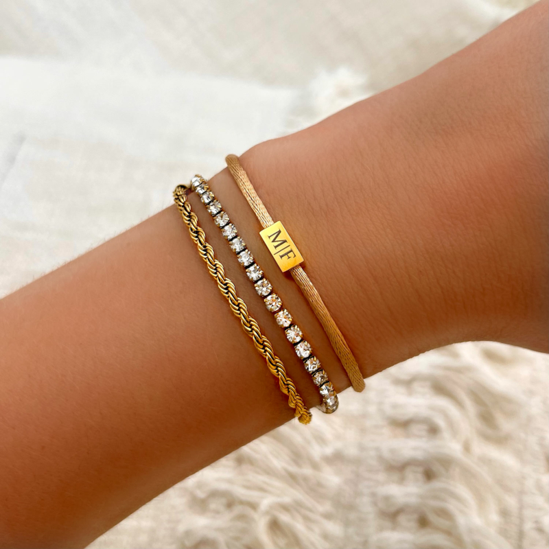 Gouden armparty met dubbele tennis armband