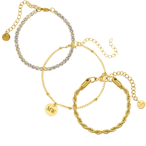 gouden armparty met drie armbanden