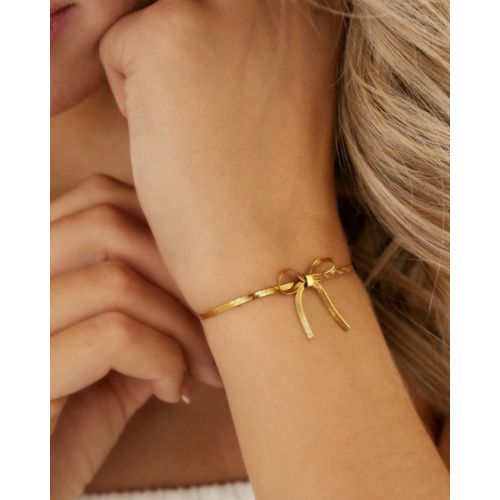 Armband met trending strikje kleur goud