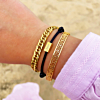 gouden armparty met gravering