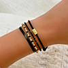 Zwarte armparty met goud