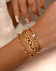 Gouden armparty met chains