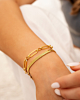 Gouden armparty met chains