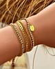 Armparty met gouden tennis armband