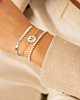 Zilveren armparty met initial