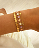 Gouden armparty met bloemetjes