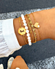 Gouden armparty met parels