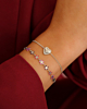 Zilveren armparty met hartjes en bloemetjes