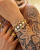 Gouden armparty met bloemetjes