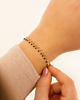 Gouden armband met zwarte details