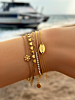 Gouden armbanden mix