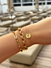 Gouden armparty met chunky armbanden