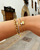 Gouden armparty met steentjes