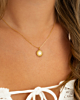 Gouden zon ketting met sea shell