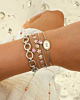 Zilveren armparty met roze details